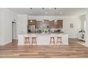 Spacious kitchen with a large center island, stainless appliances, and modern finishes at 1001 Jarrett Bay Rd, Willow Springs, NC 27592