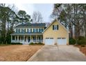 Charming two-story home with a welcoming front porch and attached two-car garage at 1007 Surry Dale Ct, Apex, NC 27502