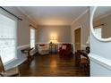 Inviting living room with ample natural light, hardwood floors, and neutral paint at 1007 Surry Dale Ct, Apex, NC 27502