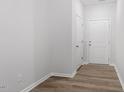 Clean, bright entryway featuring wood-look flooring, white walls, and a closet, offering a welcoming first impression at 120 Central Townes Way # 292, Raleigh, NC 27603