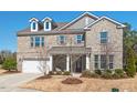 Beautiful two-story brick home with dormers, shutters and a two car garage at 126 Filigree Way, Durham, NC 27713
