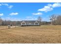 Expansive lot features a one-story home with a spacious yard and ample parking at 130 Hardy Rd, Wendell, NC 27591