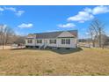 Attractive one-story home with a spacious yard, showcasing the exterior and serene surroundings at 130 Hardy Rd, Wendell, NC 27591