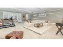 Spacious basement living area, perfect for recreation or entertainment, with natural light and plush carpet at 1327 Gloriosa St, Apex, NC 27523