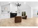 Spacious living room with a fireplace, built-in shelves, recessed lighting, and a ceiling fan at 1423 Sagamore Dr, Louisburg, NC 27549