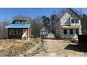 New homes under construction featuring different styles and exteriors in a developing neighborhood at 1448C Maplewood Dr, Durham, NC 27704