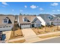 An aerial view of several homes in a suburban neighborhood on a sunny day at 163 Auburn Village Blvd, Raleigh, NC 27610