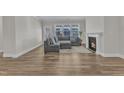 Inviting living room features a fireplace, hardwood floors, and ample natural light at 1776 Golden Honey Dr, Wake Forest, NC 27587