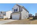 Charming two-story home with a two-car garage and neutral siding at 2105 Attend Xing, Fuquay Varina, NC 27526