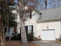 Traditional two-story home with white siding, black shutters, and a one-car garage at 3109 Benton Cir, Raleigh, NC 27615
