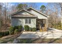 Charming home featuring a covered front porch with natural wood at 3741 Manly Farm Rd, Wake Forest, NC 27587