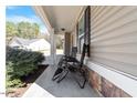 Relaxing front porch space with seating, perfect for enjoying the outdoors at 40 Golden Timber Cir, Four Oaks, NC 27524