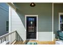 Inviting front entrance featuring a modern door and stylish porch decor at 650 Great Ridge Pkwy, Chapel Hill, NC 27516