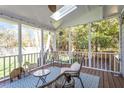 Cozy screened porch with comfortable seating, offering a relaxing outdoor living space at 8617 Canoe Ct, Raleigh, NC 27615
