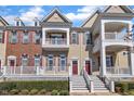 Attractive multi-level townhome with a front porch and a combination of siding and brick at 10510 Sablewood Dr # 108, Raleigh, NC 27617
