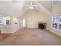 Spacious living room with vaulted ceilings and a stone fireplace perfect for entertaining at 110 Chickasaw Cir, Clayton, NC 27527