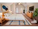 This spacious main bedroom is virtually staged with nice decor and a vaulted ceiling at 110 Chickasaw Cir, Clayton, NC 27527
