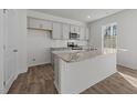 Modern kitchen featuring stainless steel appliances, granite countertops and subway tile backsplash at 117 Pisgah St, Sanford, NC 27330