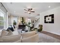Cozy living room featuring modern decor, lots of natural light, stylish furniture, stairs and hardwood floors at 131 E Victory View. Ter, Smithfield, NC 27577