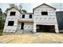 New two-story home construction with visible framing and weather-resistant wrap at 1912 Harrell Cove Ct # 171 Gunnison Cr, Fuquay Varina, NC 27526