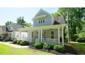 Inviting home with a lovely front porch, perfect for relaxing outdoors at 206 Pine St, Fuquay Varina, NC 27526