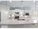Bright kitchen with granite countertops, stainless steel appliances, and white subway tile at 216 Kalmia Dr, Durham, NC 27703