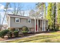 Charming two-story home showcasing mature trees and a welcoming front yard at 305 Cliffview Dr, Knightdale, NC 27545