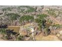 Picture of a secluded home with ponds in the woods from above at 4200 Us 1 Highway South, Kittrell, NC 27544