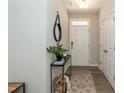 Welcoming entryway with a stylish console table and modern decor at 5917 Kayton St, Raleigh, NC 27616