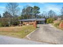 Charming single-story brick home with a covered carport and landscaped front yard at 608 N 15Th St, Erwin, NC 28339