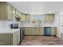 Updated kitchen featuring stylish cabinets, modern appliances, and sleek countertops at 608 N 15Th St, Erwin, NC 28339