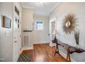 Inviting foyer features hardwood floors, a striking mirror, and classic architectural details, creating a warm welcome at 611 S Buchanan Blvd, Durham, NC 27701