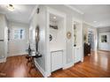 Elegant living room features custom built-ins, hardwood floors, and a stylish design, perfect for entertaining and relaxing at 611 S Buchanan Blvd, Durham, NC 27701