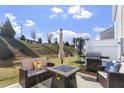 Enjoy outdoor living on this patio with comfortable seating, a fire pit, and a BBQ grill at 63 Pale Moss Dr, Clayton, NC 27527