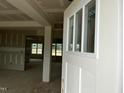 Bright entryway with large windows providing views into unfinished home at 896 Olive Branch Dr, Smithfield, NC 27577