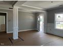 Inviting living room showcasing decorative columns and natural light at 896 Olive Branch Dr, Smithfield, NC 27577