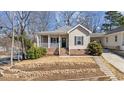 Charming single-Gathering home featuring a welcoming front porch and landscaped yard at 1024 Onslow St, Durham, NC 27705