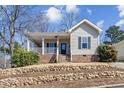 Charming single-Gathering home featuring a welcoming front porch and landscaped yard at 1024 Onslow St, Durham, NC 27705