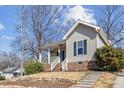 Charming single-Gathering home featuring a welcoming front porch and landscaped yard at 1024 Onslow St, Durham, NC 27705