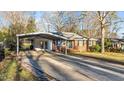 Charming single-Gathering brick home featuring a convenient covered carport and well-kept lawn at 104 Seaman St, Oxford, NC 27565
