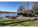 Well-equipped boat dock with boat storage and comfortable seating area on the lake at 106 Nashua Cv, Louisburg, NC 27549