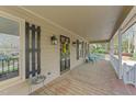 Inviting covered front porch with seating and decorative touches at 1208 Turner Farms Rd, Garner, NC 27529