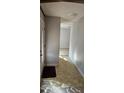 Inviting entryway with neutral walls, tile flooring, and an open view into the living spaces at 319 Davis Rd, Hillsborough, NC 27278