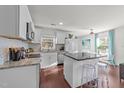 Bright, updated kitchen features granite countertops, stainless appliances, and a center island at 449 Parnell Dr, Raleigh, NC 27610