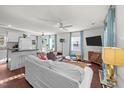 Open-concept living room seamlessly connects to the kitchen and dining area, perfect for entertaining at 449 Parnell Dr, Raleigh, NC 27610