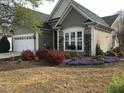 Home with a two-car garage and colorful landscaping at 512 Garendon Dr, Cary, NC 27519