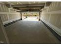 Empty two car garage, freshly painted, with open garage door at 526 Billingshurst Way # 211, Knightdale, NC 27545