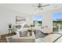 Bright living room features modern decor, lots of natural light, and access to outdoor balcony at 526 Billingshurst Way, Knightdale, NC 27545