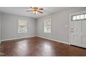 Cozy living room with hardwood floors, ceiling fan, and natural light at 617 Bernice St, Durham, NC 27703