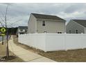 A backyard featuring a white fence, offering privacy and security for outdoor enjoyment at 745 Little Patch St, Zebulon, NC 27597